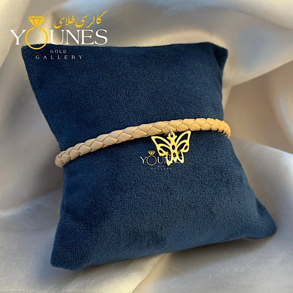 دستبند چرم کرمی پروانه لیزری طلا